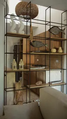 a shelf with many different items on it at Alquiler casa en la playa, Tolu in Tolú