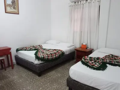 a hotel room with two beds with blankets on them at Hotel Montecarlo Beach in Tolú