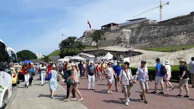 a large group of people walking down a street at Comfort La Española in Cartagena de Indias