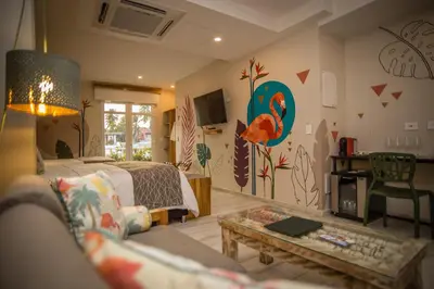 a living room with a bed and a table at Townhouse Boutique Hotel in Cartagena de Indias