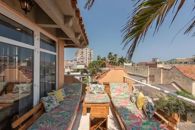 a balcony with couches and a table on a building at Townhouse Boutique Hotel in Cartagena de Indias