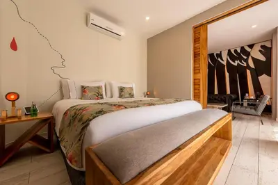 a bedroom with a large bed in a room at Townhouse Boutique Hotel in Cartagena de Indias