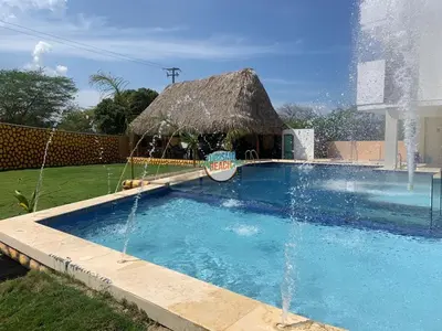 a swimming pool with a fountain in a yard at Special Life Beach in Tubará
