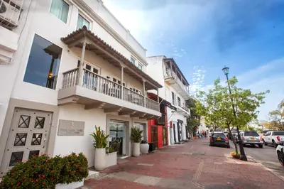 a building with a balcony on a city street at Hotel Santa Cecilia B&B in Cartagena de Indias
