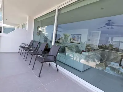 a row of chairs sitting on a balcony with a aquarium at Karibana Espectacular in Cartagena de Indias