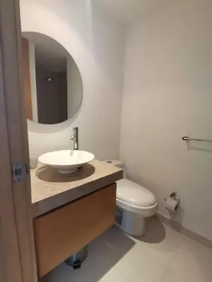 a bathroom with a sink and a toilet and a mirror at Karibana Espectacular in Cartagena de Indias