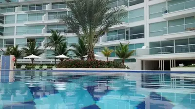 a swimming pool in front of a building at Karibana Espectacular in Cartagena de Indias
