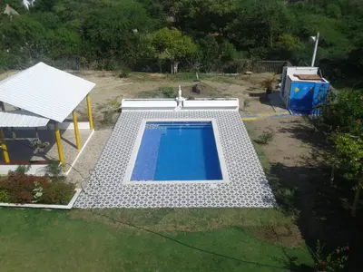 an overhead view of a swimming pool in a yard at Casa de Campo Palmarito in Tubará