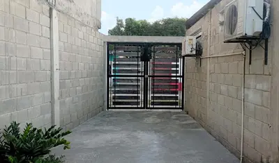 an entrance to a building with a gate in it at Apartamento Aeromar, Santa Marta in Santa Marta