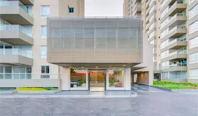 an external view of a building with a glass door at Apartamentos Oceana - Cerca al Buenavista by SOHO in Barranquilla