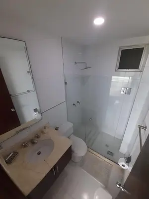 a bathroom with a shower and a sink and a toilet at Morros con acceso directo a la playa in Cartagena de Indias