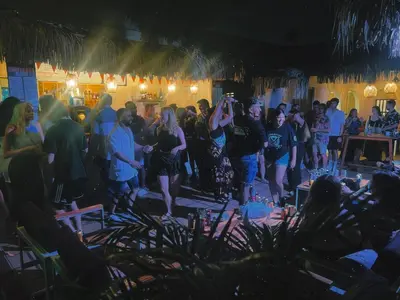 a group of people standing in a crowd at a party at Viajero Cartagena - Centro Hostel in Cartagena de Indias