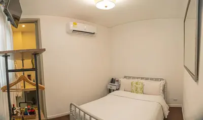 a small bedroom with a bed and a heater at Hotel Monaguillo de Getsemaní in Cartagena de Indias