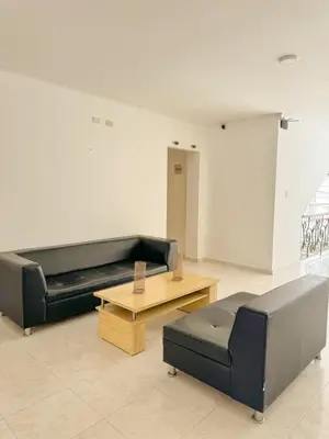 a living room with a couch and a coffee table at Hotel Ginebra Sincelejo in Sincelejo