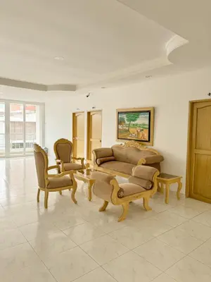 a living room with two couches and two chairs at Hotel Ginebra Sincelejo in Sincelejo
