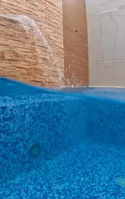 a swimming pool with water shooting up into the air at Hotel Barlovento in Cartagena de Indias