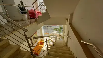a staircase in a building with a stair case at Perla De La Sabana in Corozal