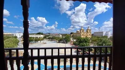 a view of a city from a balcony at Perla De La Sabana in Corozal