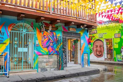 a building with a painting on the side of it at Hotel Casa Centenario Getsemaní in Cartagena de Indias