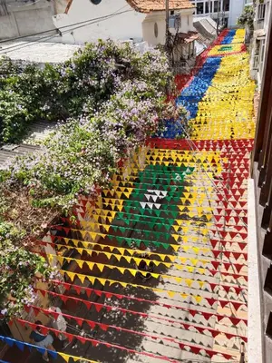 a multicolored staircase with flowers on it at Hotel Casa Centenario Getsemaní in Cartagena de Indias