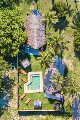 an overhead view of a house with a swimming pool at Hotel Isla Mucura in Isla Mucura