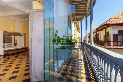 a balcony of a building with a checkered floor at La Passion by Masaya Collection in Cartagena de Indias