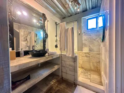 a large bathroom with a sink and a shower at La Passion by Masaya Collection in Cartagena de Indias