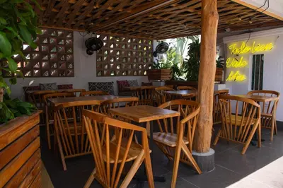 a group of tables and chairs in a restaurant at La Passion by Masaya Collection in Cartagena de Indias