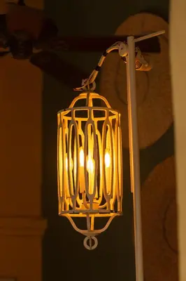 a lit up lamp hanging from a pole at Nacar Hotel Cartagena, Curio Collection by Hilton in Cartagena de Indias