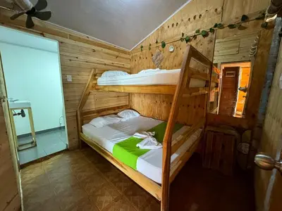 a bedroom with two bunk beds in a room at Raw KokoMar CasaNativa in Baru