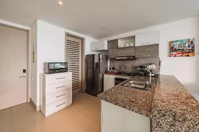 a kitchen with a sink and a counter top at Palmetto Beach by MOME in Cartagena de Indias
