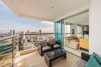 a living room with a view of the city at Palmetto Beach by MOME in Cartagena de Indias