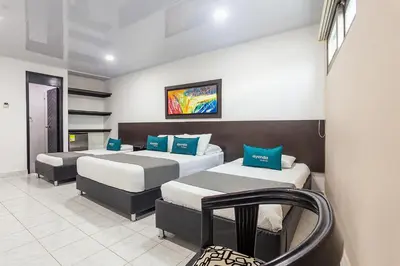 a room with two beds in a room at Hotel Ancor in Sincelejo