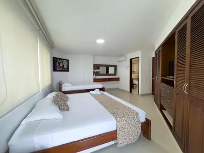 a bedroom with a bed and a television in it at Apartamento semi penhouse in Cartagena de Indias