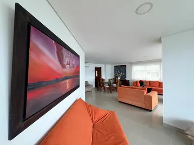a living room with a large painting on the wall at Apartamento semi penhouse in Cartagena de Indias