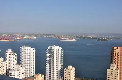 a view of a city with a cruise ship in the water at Apartamentos Palmeto Cartagena Nª3401 in Cartagena de Indias