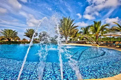 a fountain in the middle of a swimming pool at Estelar Playa Manzanillo - All inclusive in Cartagena de Indias