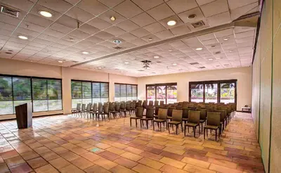 a large room with chairs and tables and windows at Estelar Playa Manzanillo - All inclusive in Cartagena de Indias