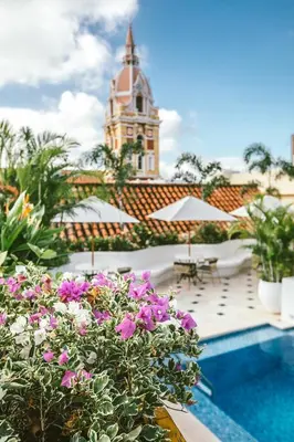 a view of a building with a pool and flowers at Amarla Boutique Hotel Cartagena in Cartagena de Indias