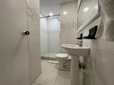 a bathroom with a toilet and a sink and a shower at Apartamento por temporadas en Bocagrande Cartagena in Cartagena de Indias