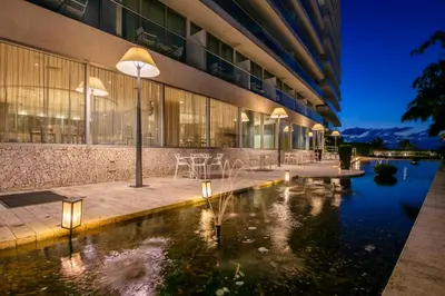 a hotel with a pond in front of a building at Holiday Inn Cartagena Morros by IHG in Cartagena de Indias