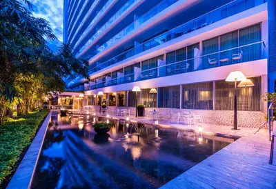 a hotel with a pool in front of a building at Holiday Inn Cartagena Morros by IHG in Cartagena de Indias