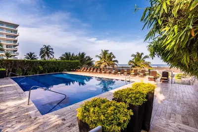 a swimming pool with a view of the beach at Holiday Inn Cartagena Morros by IHG in Cartagena de Indias