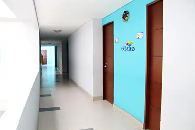 a hallway in a hospital with a sign on the wall at Ayenda 1801 El Oceano in Cartagena de Indias