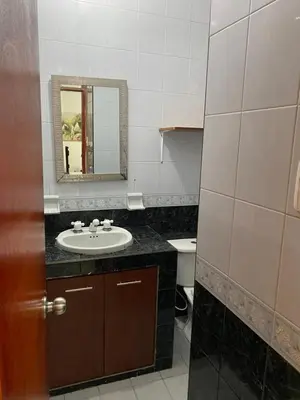 a bathroom with a sink and a mirror at Habitación I frente a la playa ( Bocagrande ) in Cartagena de Indias