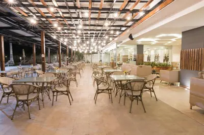 a restaurant with tables and chairs in a room at Sonesta Hotel Cartagena in Cartagena de Indias