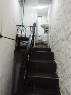 a set of stairs in a room with a stair case at Villa mar in Puerto Colombia