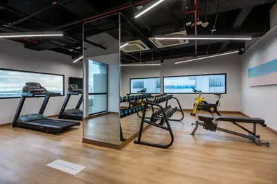 a gym with treadmills and elliptical machines at Holiday Inn Express Cartagena Manga by IHG in Cartagena de Indias