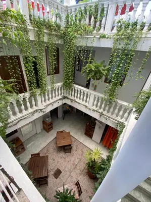 an overhead view of a courtyard with tables and plants at Patio de Getsemani in Cartagena de Indias