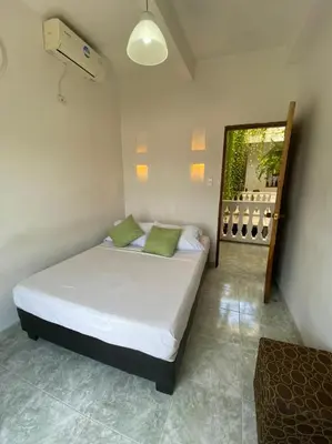 a bedroom with a bed in a room at Patio de Getsemani in Cartagena de Indias